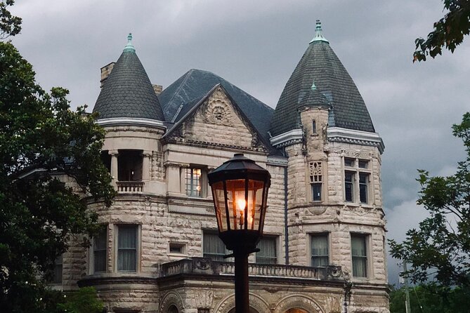 Turreted stone mansion behind a gas street lamp in Louisville, Kentucky