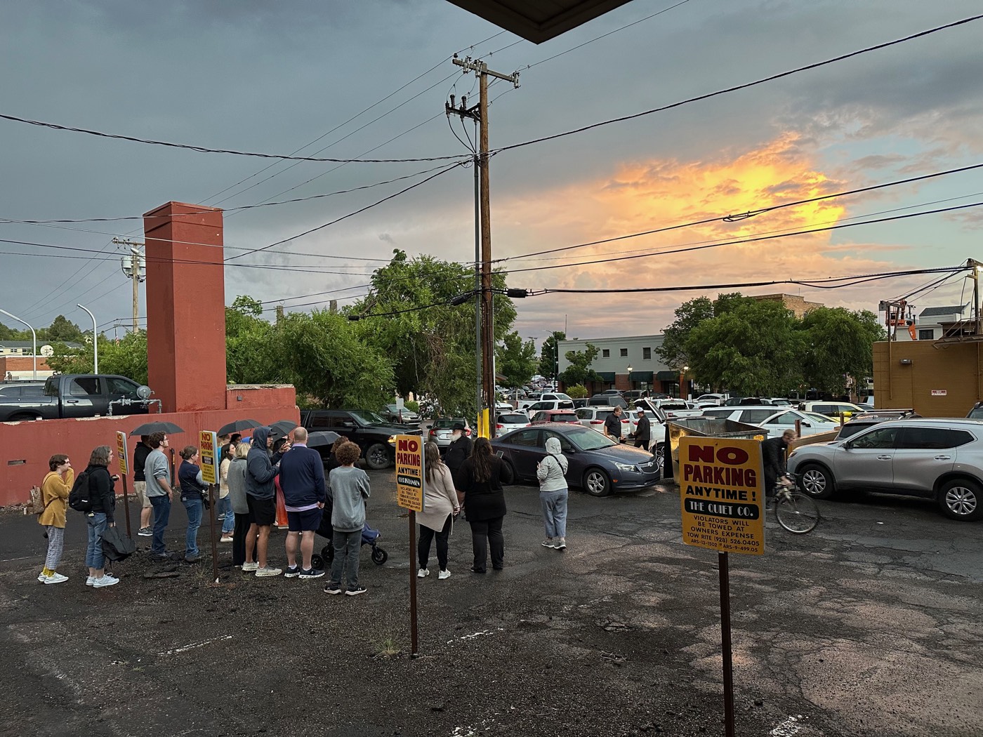 A monsoon sunset breaks over downtown as the group gathers for stories behind the historic blocks.