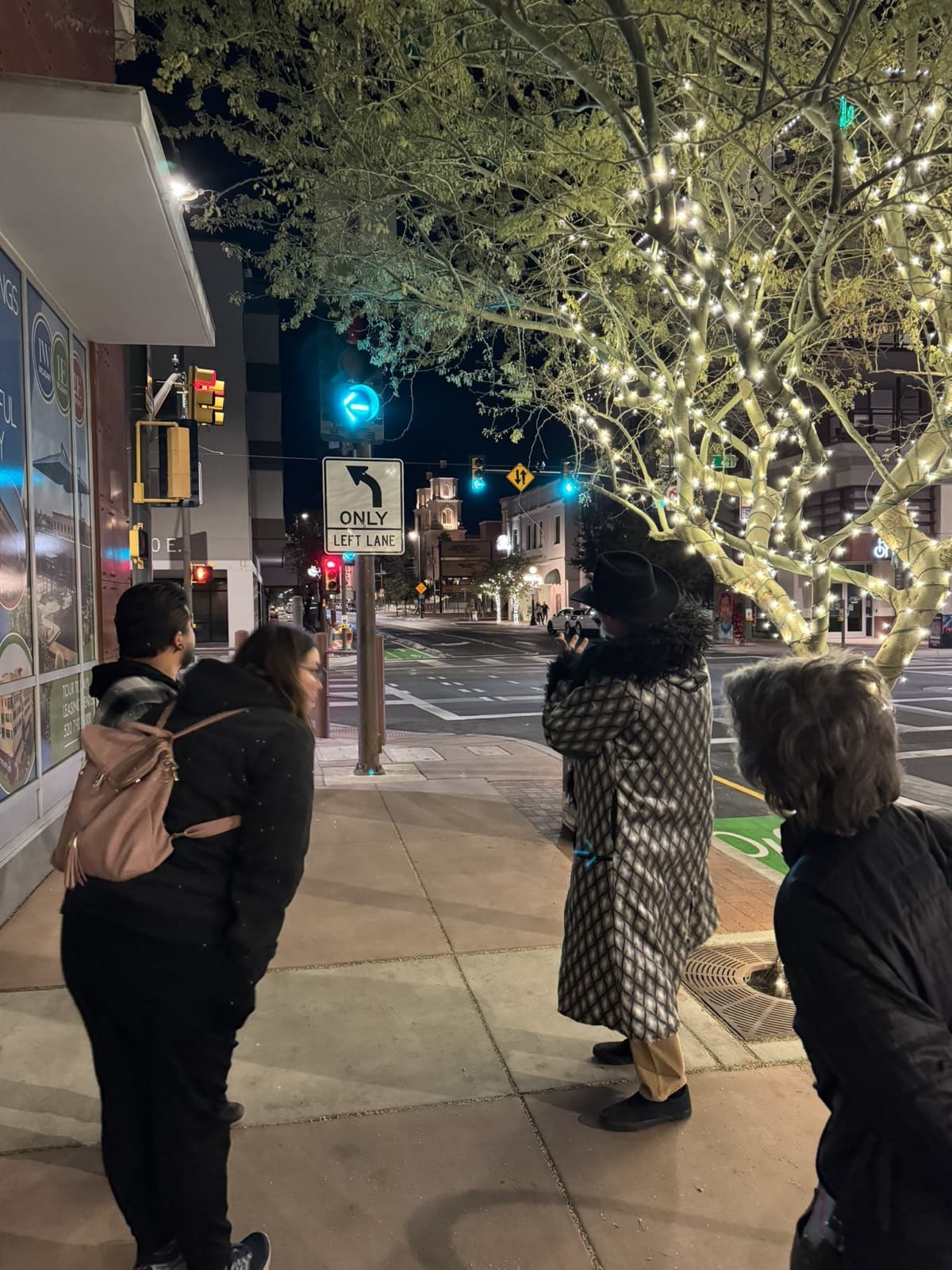 Guests crossing the Congress Street intersection on the evening ghost tour