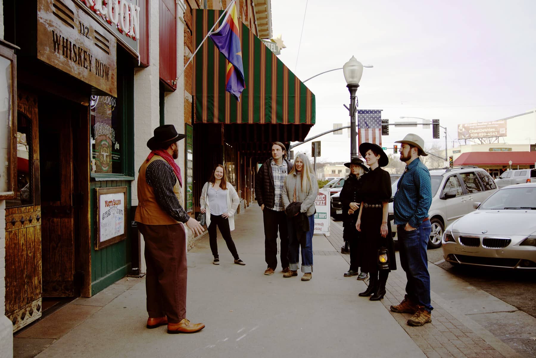 A tour group walking the Whiskey Row sidewalk on the Prescott History Tour